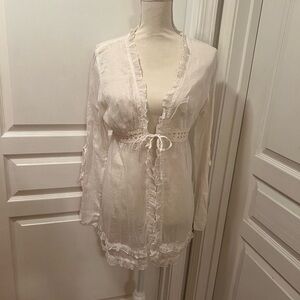 Feminine cover up with ruffles and tie size Large
